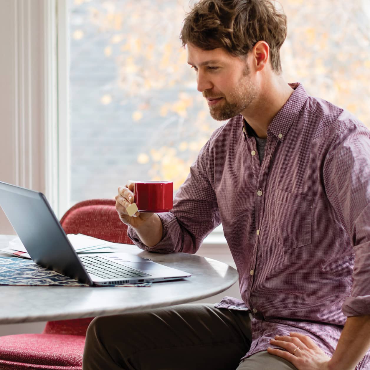 A person managing their account on their laptop.