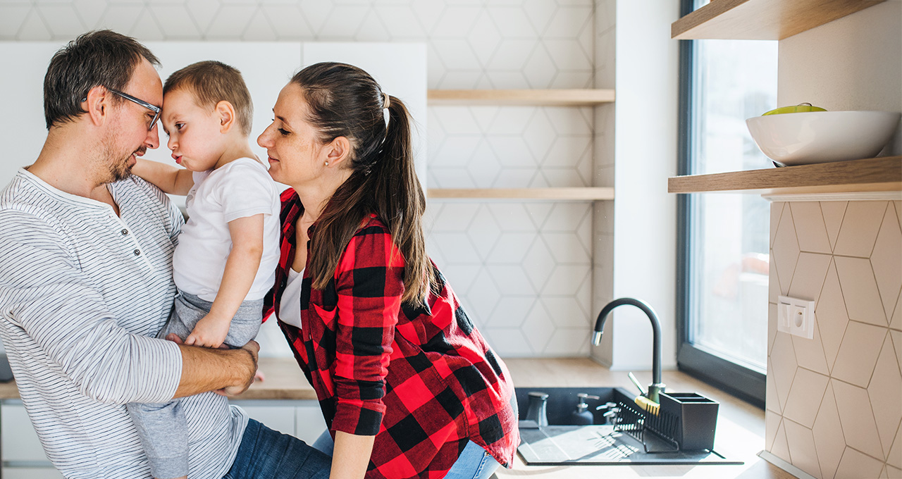 Family interacting joyfully in a modern kitchen